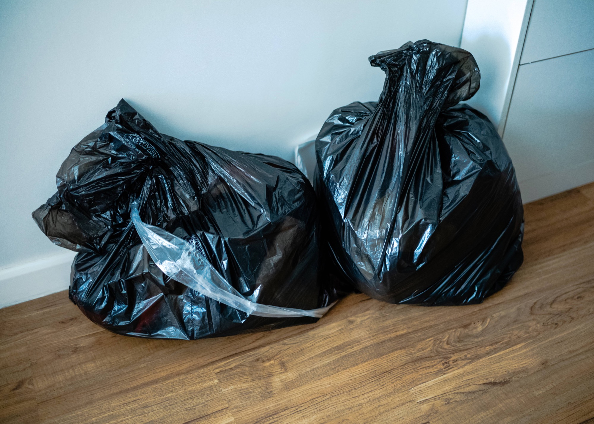 Two black trashbags filled with lothes for donation